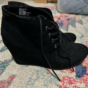 Black suede booties with wedges